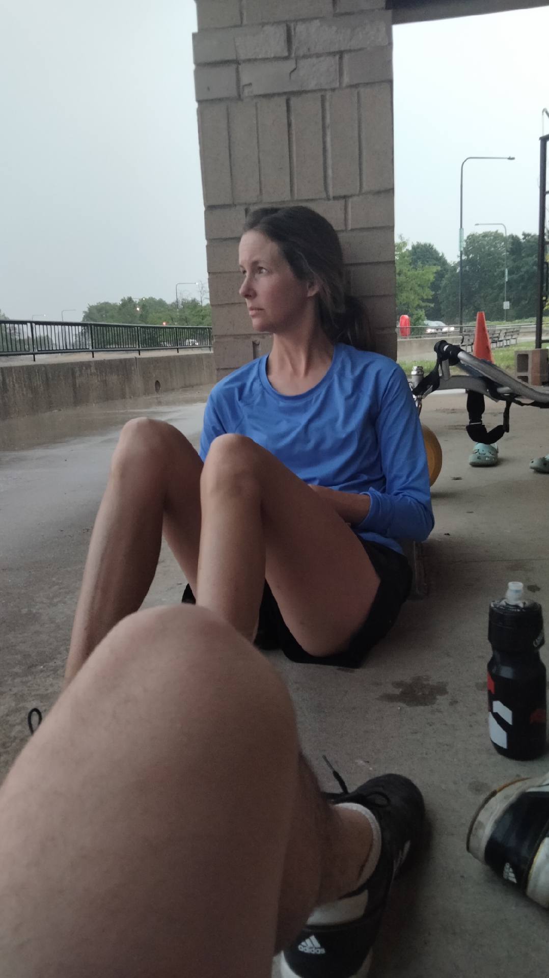 Waiting out the rain under a roof.